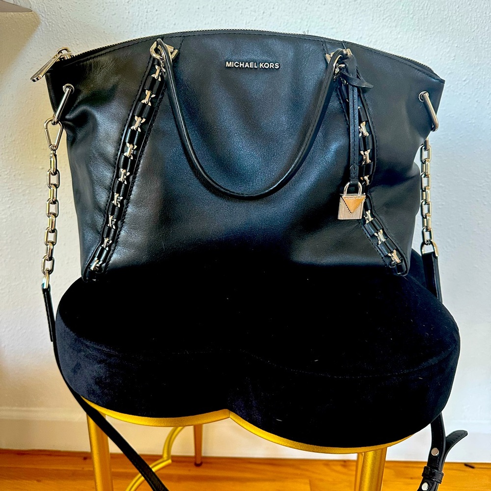 Excellent used condition Michael Kors Sadie bag in black with silver hardware.